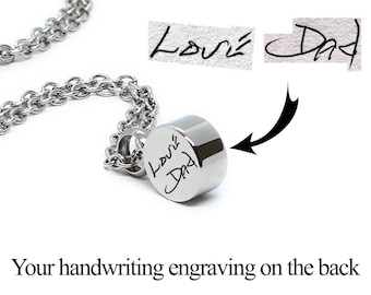 May include: Silver necklace with a round pendant engraved with the handwritten words "Love Dad".