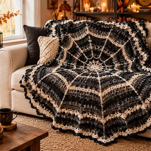 May include: A large, circular crochet blanket featuring a black and cream spiderweb pattern. The design consists of radiating spokes and concentric rings, finished with a scalloped edge. The yarn work alternates between dark and light sections.