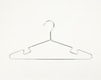 May include: A silver metal hanger with a curved top and a slightly angled bottom. The hanger has a smooth, shiny finish.