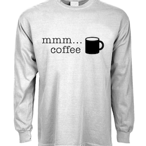 May include: A gray long-sleeve t-shirt with the text "mmm... coffee" and a black silhouette of a coffee mug.