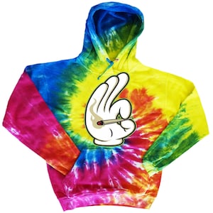 May include: A tie-dye hoodie featuring a cartoon hand making the 'okay' sign, holding a lit joint. The hoodie is a blend of blue, green, yellow, orange, pink, and red.