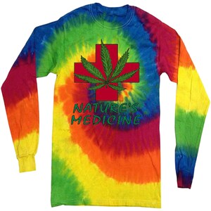 May include: A long-sleeved tie-dye shirt featuring a red cross with a green marijuana leaf design. The shirt has the text "NATURE'S MEDICINE" printed on it.
