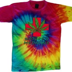May include: A tie-dye t-shirt featuring a red cross with a green marijuana leaf. The text "Nature's Medicine" is printed below the cross.