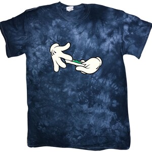 May include: A blue tie-dye t-shirt featuring a cartoon image of two hands rolling a joint.