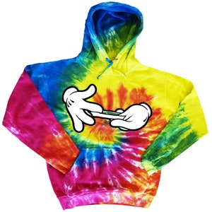 May include: A tie-dye hoodie featuring a cartoon image of two hands rolling a joint. The hoodie is a blend of blue, yellow, red, green, and pink.