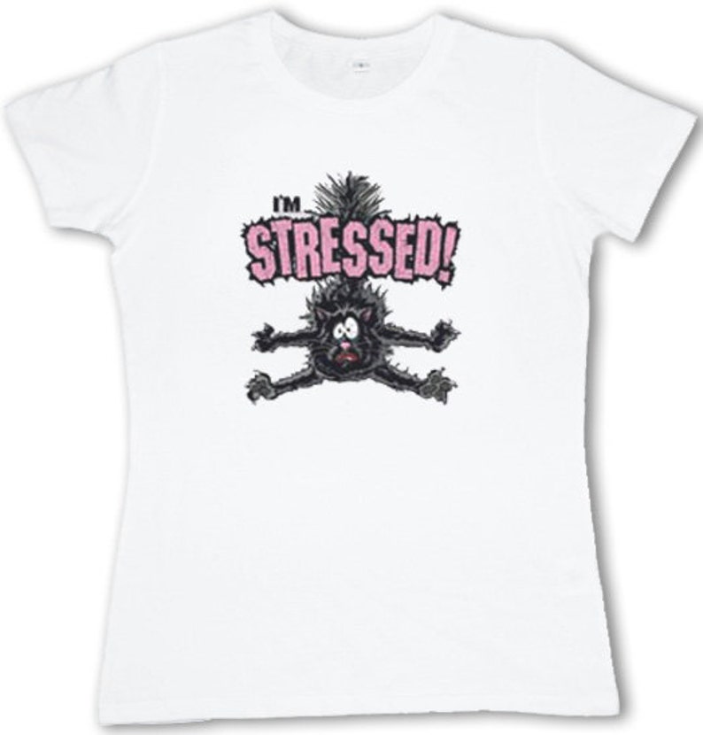 May include: White t-shirt with a black cat cartoon illustration and the text "I'm Stressed!" in pink letters.