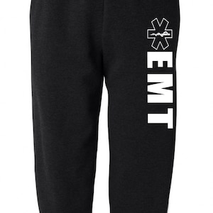 May include: Black sweatpants with a white 'EMT' and a medical symbol on the right leg.