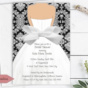 May include: A white bridal shower invitation with a black and white damask pattern. The invitation features a silhouette of a bride wearing a white dress with a large white bow. The text on the invitation reads "Please join us for a Bridal Shower honoring Kate Marie Smith 11:00am Sunday April 29th at Sagaponack 4 West 22nd Street, New York City Hosted by the Bridesmaids Registered at Bloomingdales. Williams Sonoma Please RSVP by April 15th (516) 555-9495"