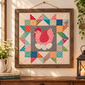May include: A square wall hanging featuring a central gray block with a pink hen sitting on white eggs. The center is surrounded by a colorful patchwork border of various floral and geometric fabric patterns, all encased in a dark wood frame.