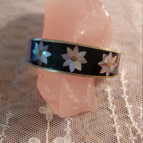 Classy Silver Cuff Bracelet from Mexico Black Onyx with inlaid pink flowers and accent strips and golden centers. Purchased in Cancun.