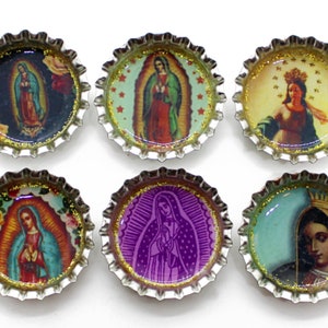 May include: Six silver bottle caps with images of the Virgin Mary. Each cap features a different image of the Virgin Mary in various colors and styles.