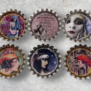 May include: Six silver bottle caps with different vintage images of women with various hairstyles and clothing. The images are surrounded by a gold glitter border.
