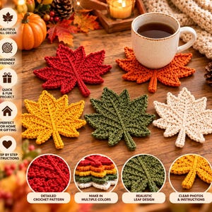 May include: A set of five crochet coasters shaped like maple leaves in red, orange, yellow, green, and cream colors. One orange coaster supports a white ceramic mug filled with dark liquid. The coasters feature detailed stitching and leaf veins.