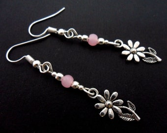 A pair of hand made tibetan silver cute little flower themed red jade bead dangly clip on earrings.