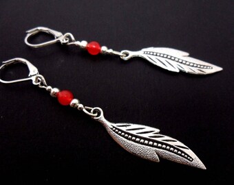 A pair of hand made tibetan silver cute little flower themed red jade bead dangly clip on earrings.