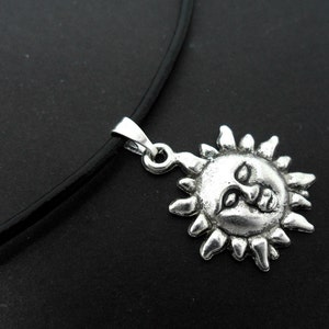 A leather cord 13" - 14" tibetan silver sun  charm choker necklace.