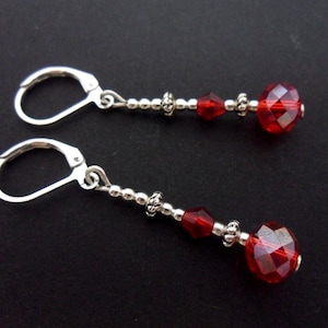 A pair of cute hand made tibetan silver dangly red  crystal bead leverback hook earrings. new.