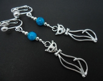 A pair of hand made cute cat  & turquoise bead tibetan silver dangly clip on earrings.