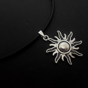 A leather cord 13" - 14" tibetan silver sun  charm choker necklace.
