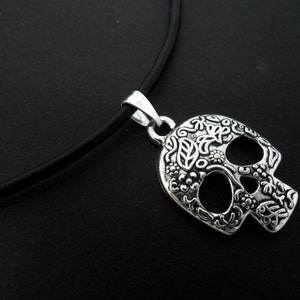 A leather cord 13&quot; - 14&quot; tibetan silver skull charm choker necklace.