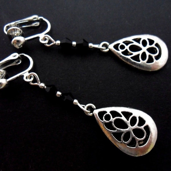 A pair of hand made tibetan silver black crystal bead teardrop   dangly clip on  earrings.