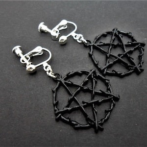 A pair of pretty black enamel pentangle pentagram themed dangly screw back clip on earrings.