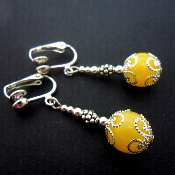 A pair of pretty yellow jade bead  dangly clip on earrings. new.