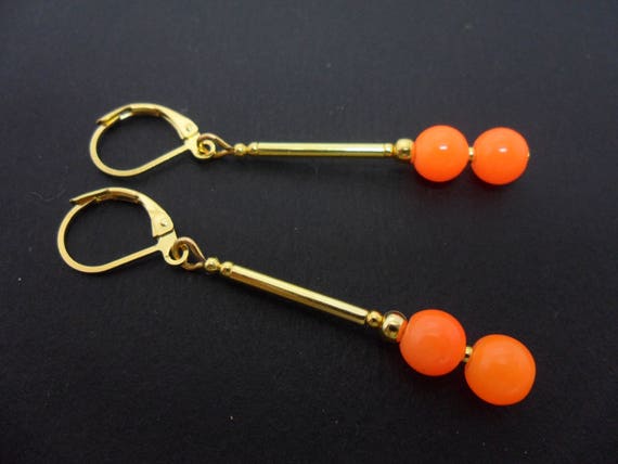 A pair of pretty orange jade bead gold plated dangly leverback hook