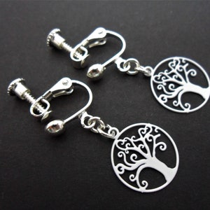 A pair of pretty stainless steel & white enamel tree of life dangly screw back clip on earrings.
