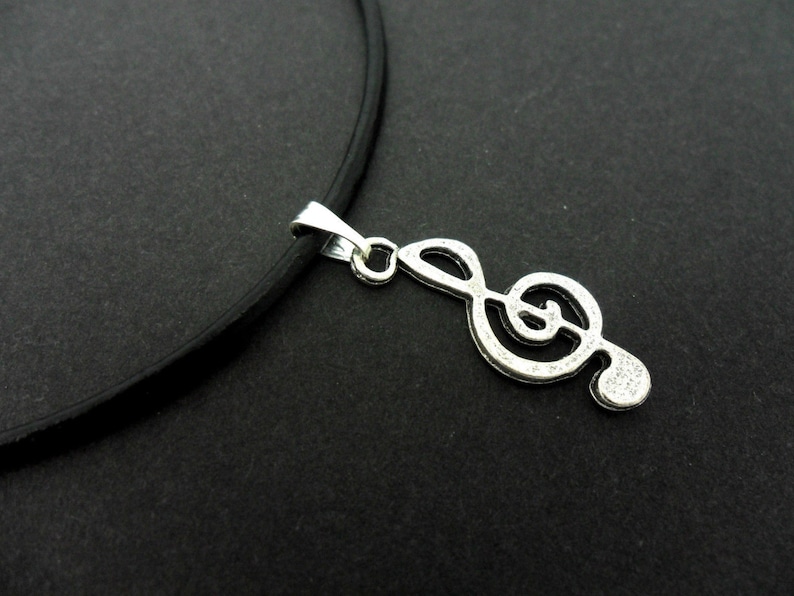 A leather cord 13-14 tibetan silver treble clef musical note charm choker necklace.