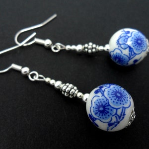 A pair of pretty porcelain flower  bead   dangly earrings.