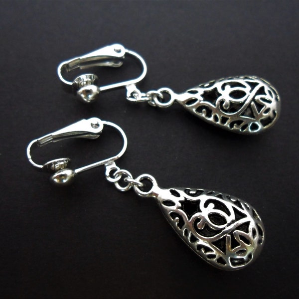 A pair of pretty tibetan silver filigree teardrop dangly clip on earrings.