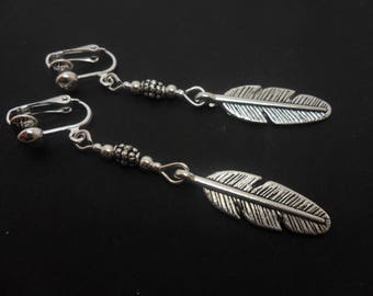A pair of  hand made tibetan silver dangly feather themed dangly clip on earrings. new.