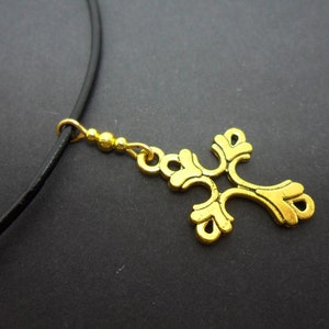 A leather cord 13&quot; - 14&quot; gold colour cross charm choker necklace.