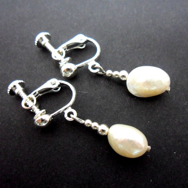 A pair of pretty white freshwater pearl  bead  dangly screw back clip on earrings.
