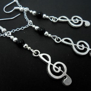 A hand made tibetan silver  musical note treble clef necklace and earring set.