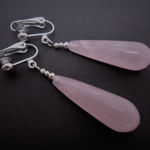 A pair of pretty pink jade bead long dangly teardrop clip on earrings.