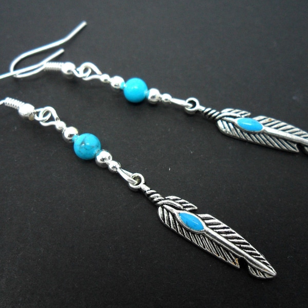 A pair of pretty tibetan silver turquoise bead feather themed dangly earrings.