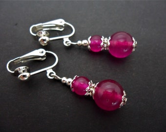A pair of pretty bright pink  jade   dangly clip on earrings.