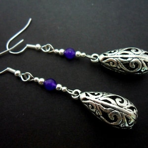 A pair of pretty tibetan silver & purple jade teardrop themed dangly earrings.
