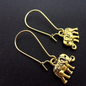 A pair of gold colour elephant earrings on kidney wire hooks. New.