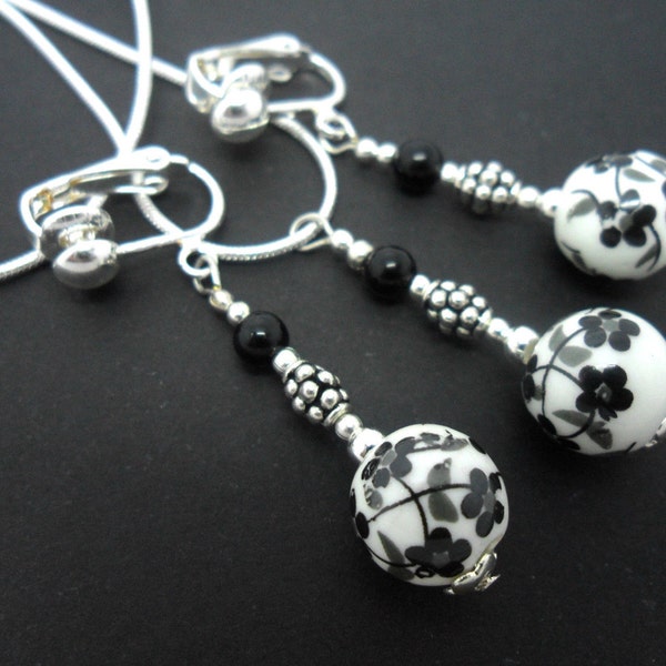 A hand made black  and white porcelain bead  necklace and clip on earring set.