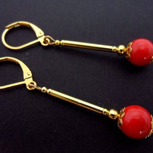 A pair of hand made long dangly gold plated red coral bead leverback hook earrings. New.