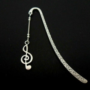 A tibetan silver and treble clef musical note charm   bookmark. 9cm long.