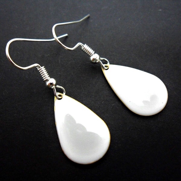 A pair of pretty white enamel teardrop dangly earrings.