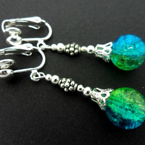 A PAIR OF TIBETAN SILVER BLUE CRYSTAL DANGLY DOLPHIN THEMED EARRINGS