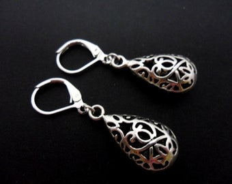 A pair of hand made tibetan silver teardrop  dangly leverback hook earrings.