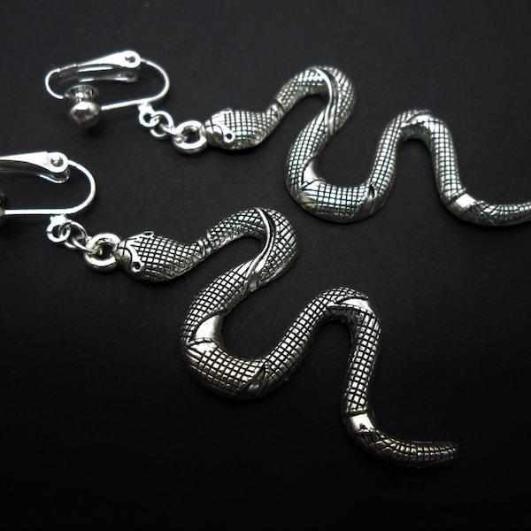 A pair of tibetan silver snake themed long dangly clip on earrings. new.