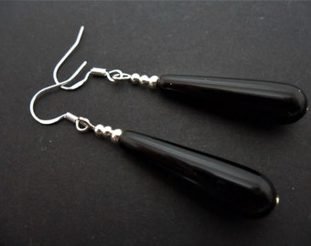 A pair of hand made silver plated black onyx teardrop bead dangly earrings with 925 solid silver hooks.
