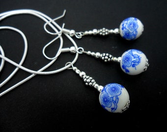 A hand made blue and white porcelain bead  necklace and earring set.